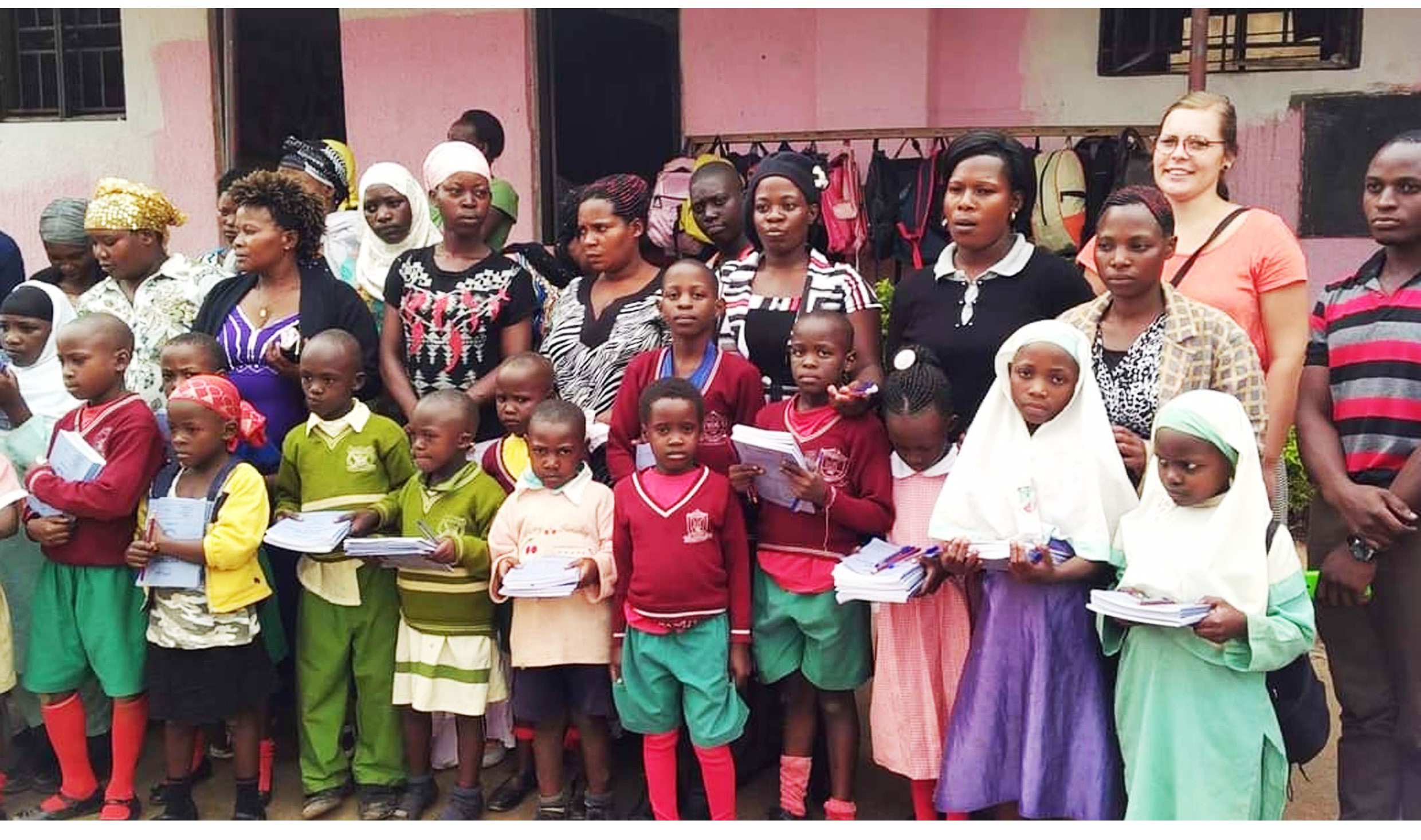 Teacher guiding poor children